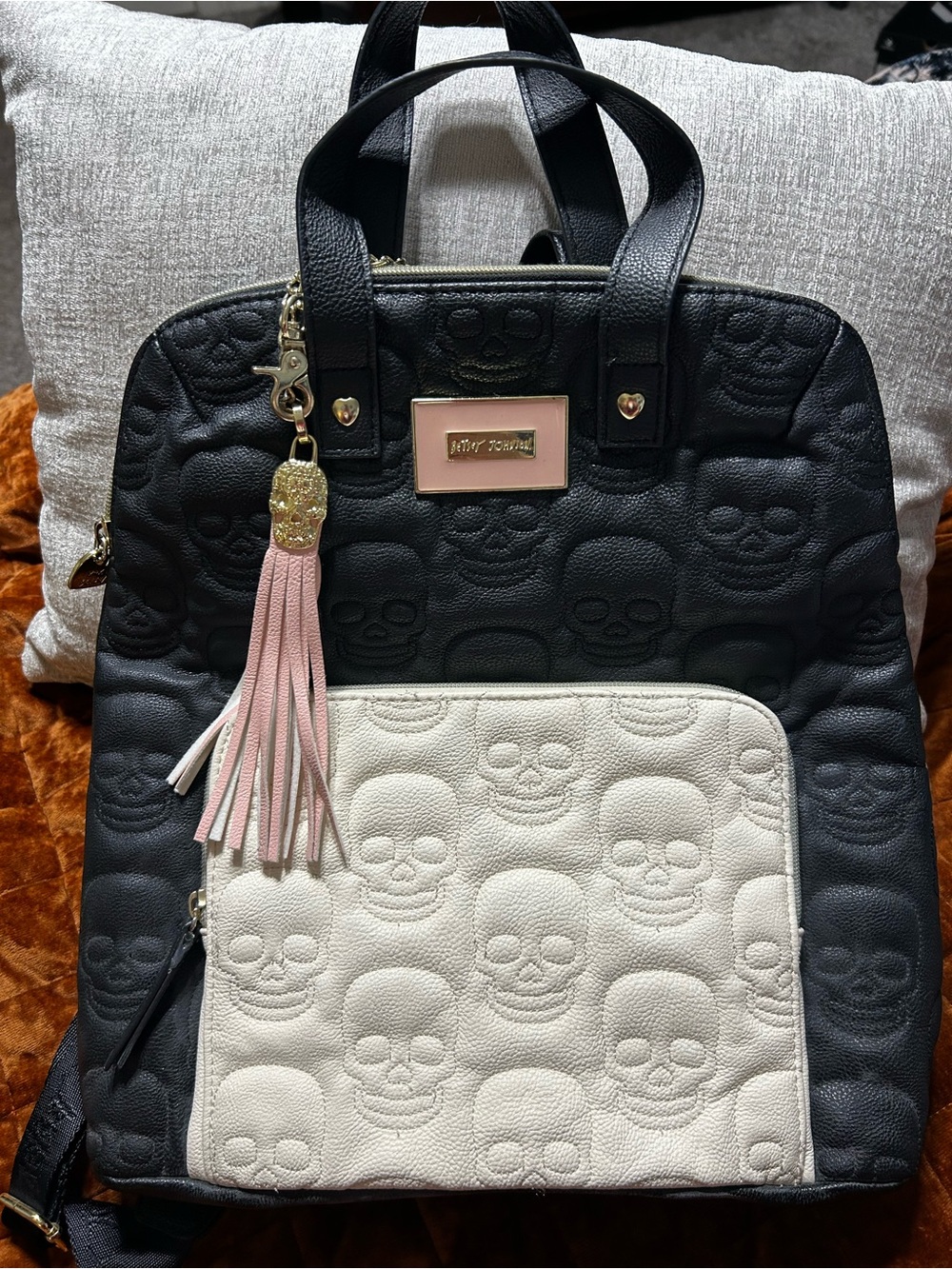Betsey Johnson Skull embossed black, cream, & pale pink backpack purse = Badass
